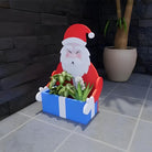 Pot de fleurs en forme de Père Noël